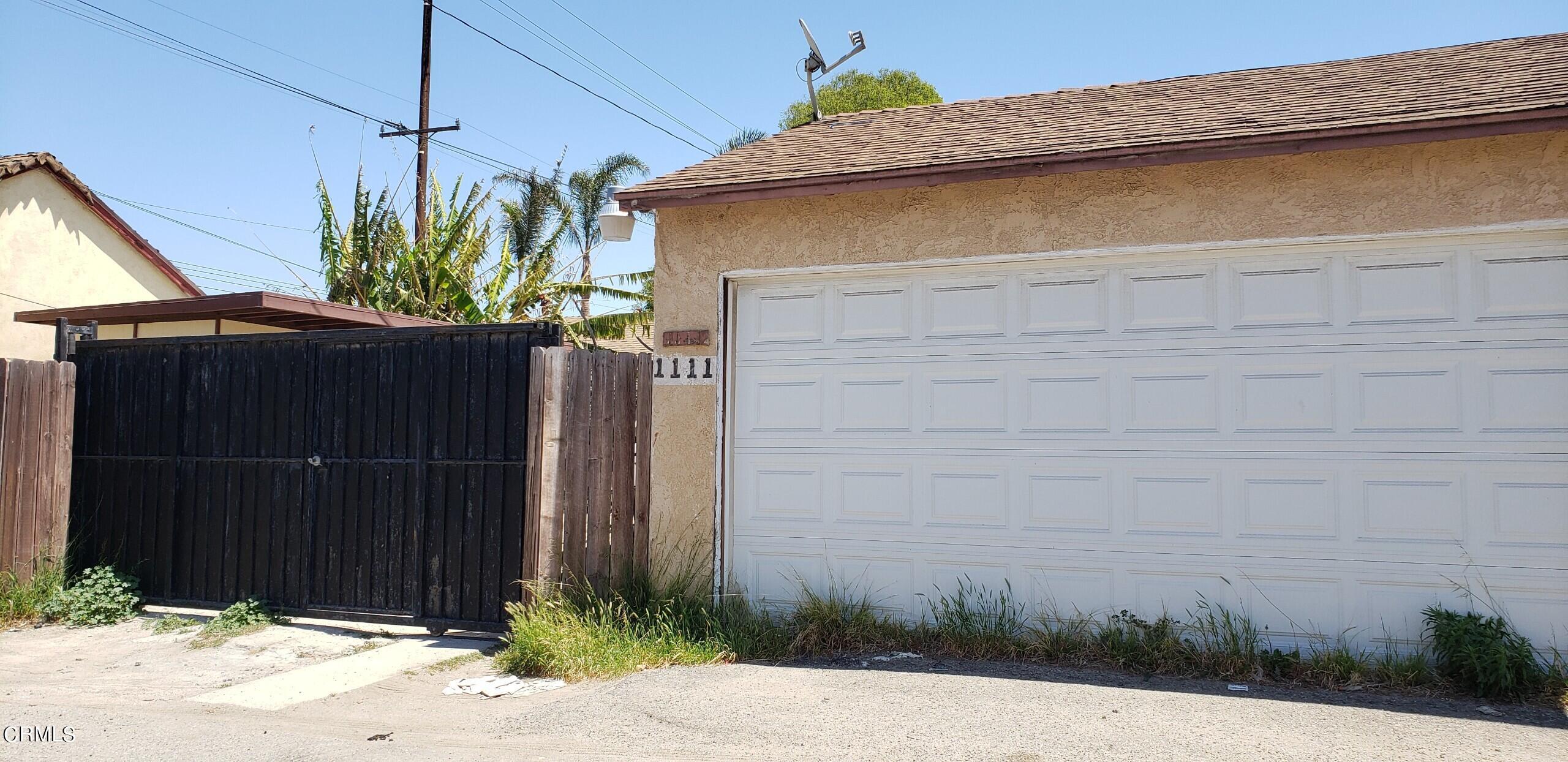 1111 South M Street Oxnard, CA 93033 - Photo 21 of 22 a couple of potted plants in front of door