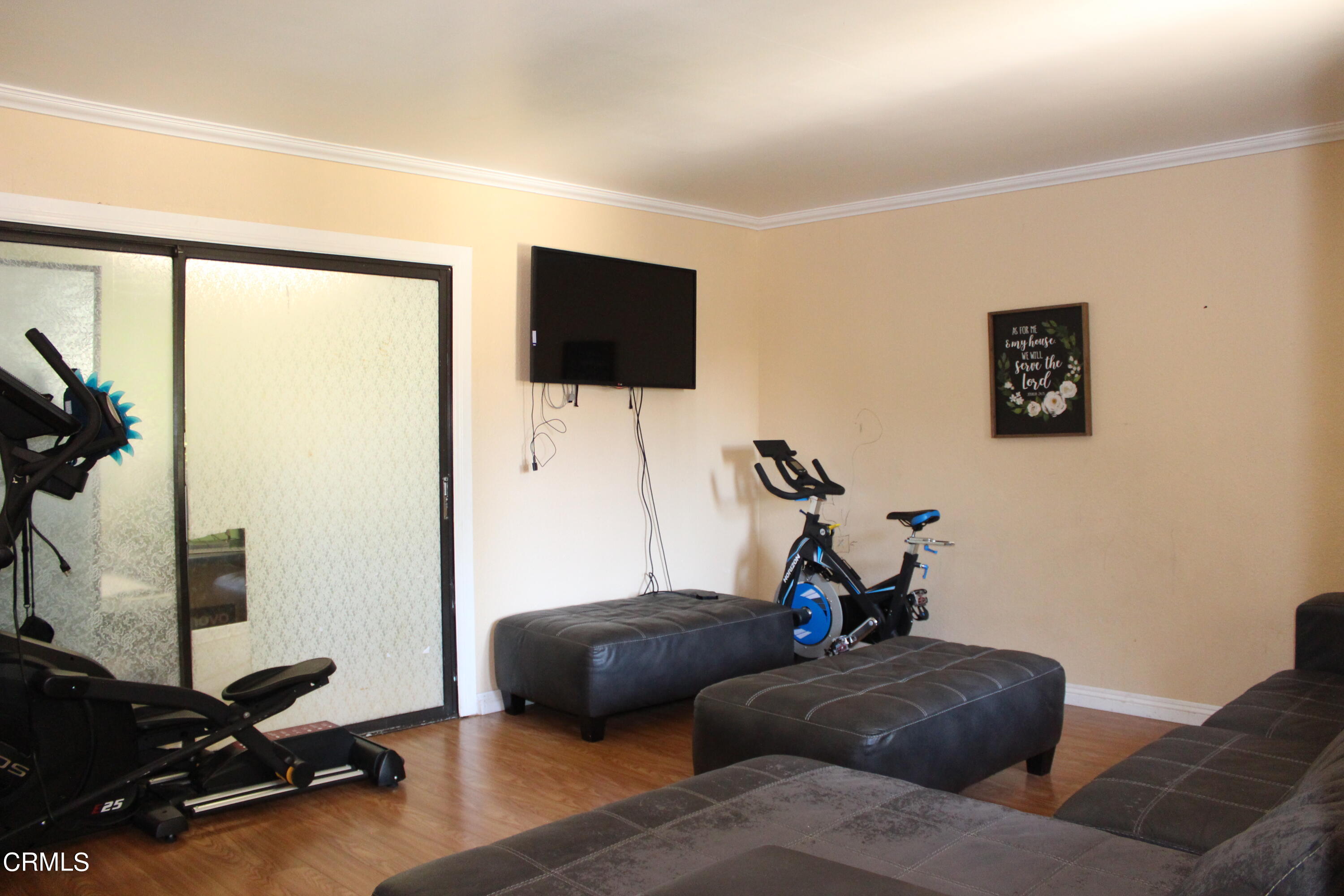 1111 South M Street Oxnard, CA 93033 - Photo 5 of 22 a living room with furniture and a flat screen tv