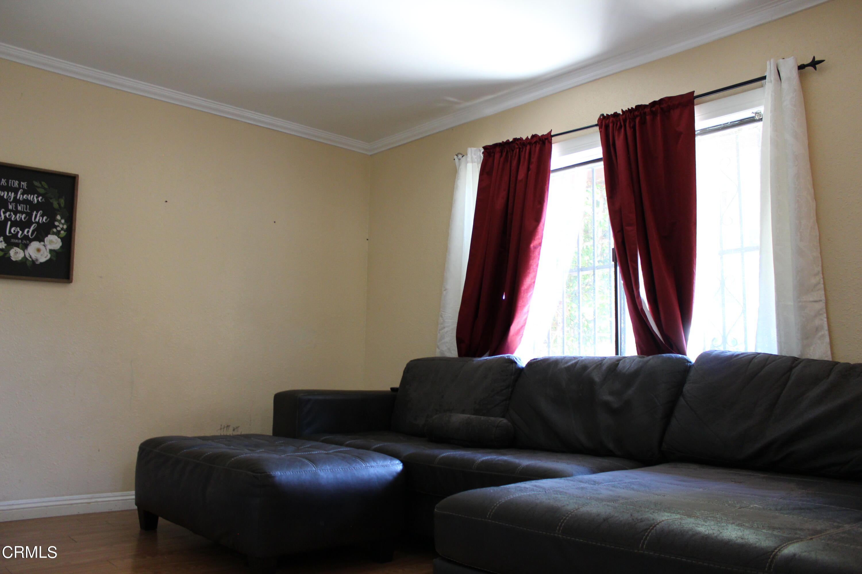 1111 South M Street Oxnard, CA 93033 - Photo 6 of 22 a living room with furniture and a window