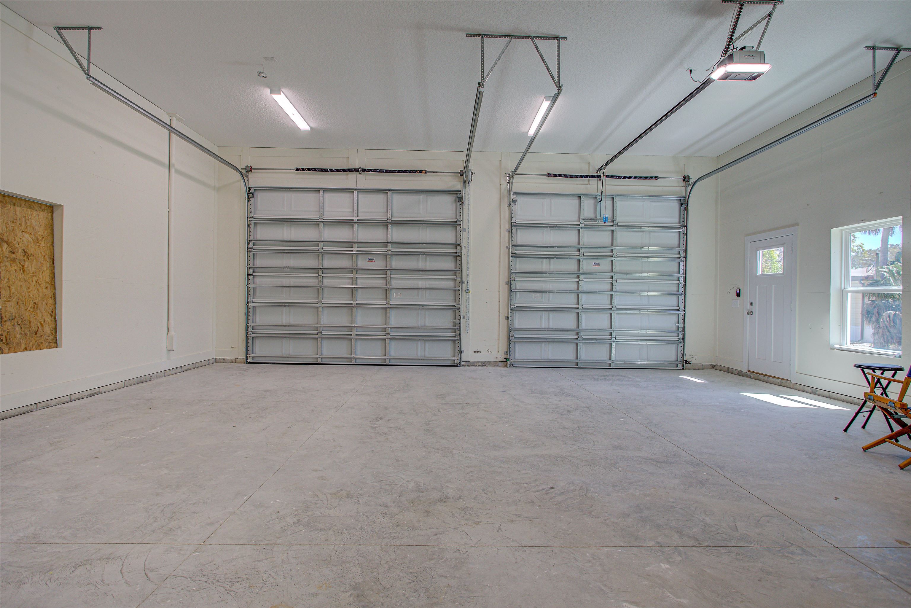 253 Desoto Road St. Augustine, FL 32080 - Photo 23 of 25 Garage featuring a garage door opener