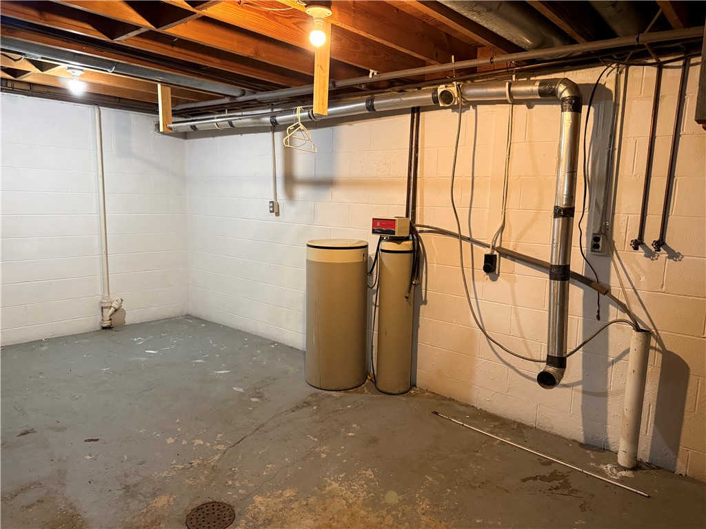 4732 Lehigh Drive Springfield, OH 45503 - Photo 21 of 27 This functional basement space offers practical utility and storage solutions.