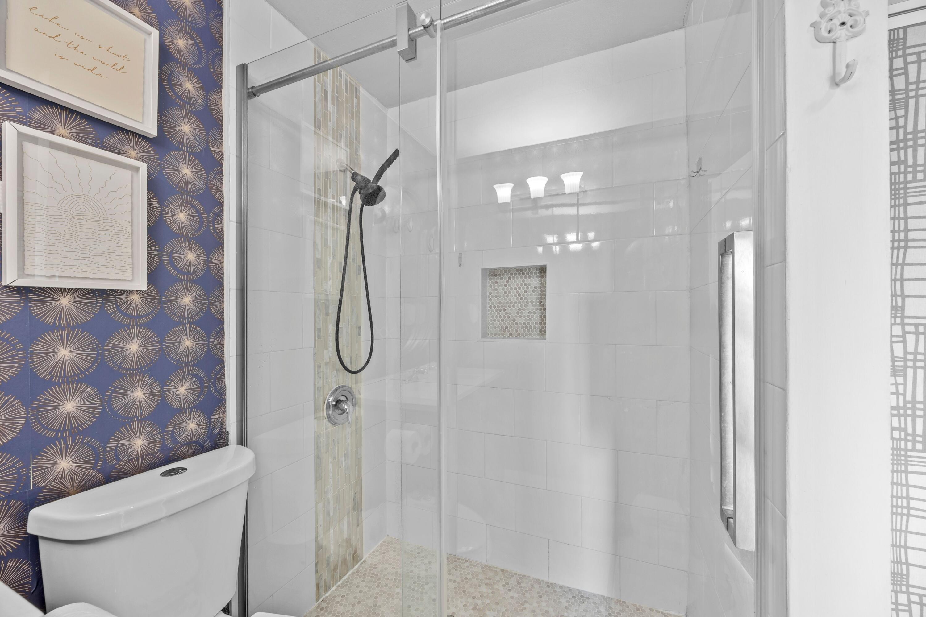 1520 Shaker Circle Wellington, FL 33414 - Photo 16 of 19 a bathroom with a shower a toilet and sink