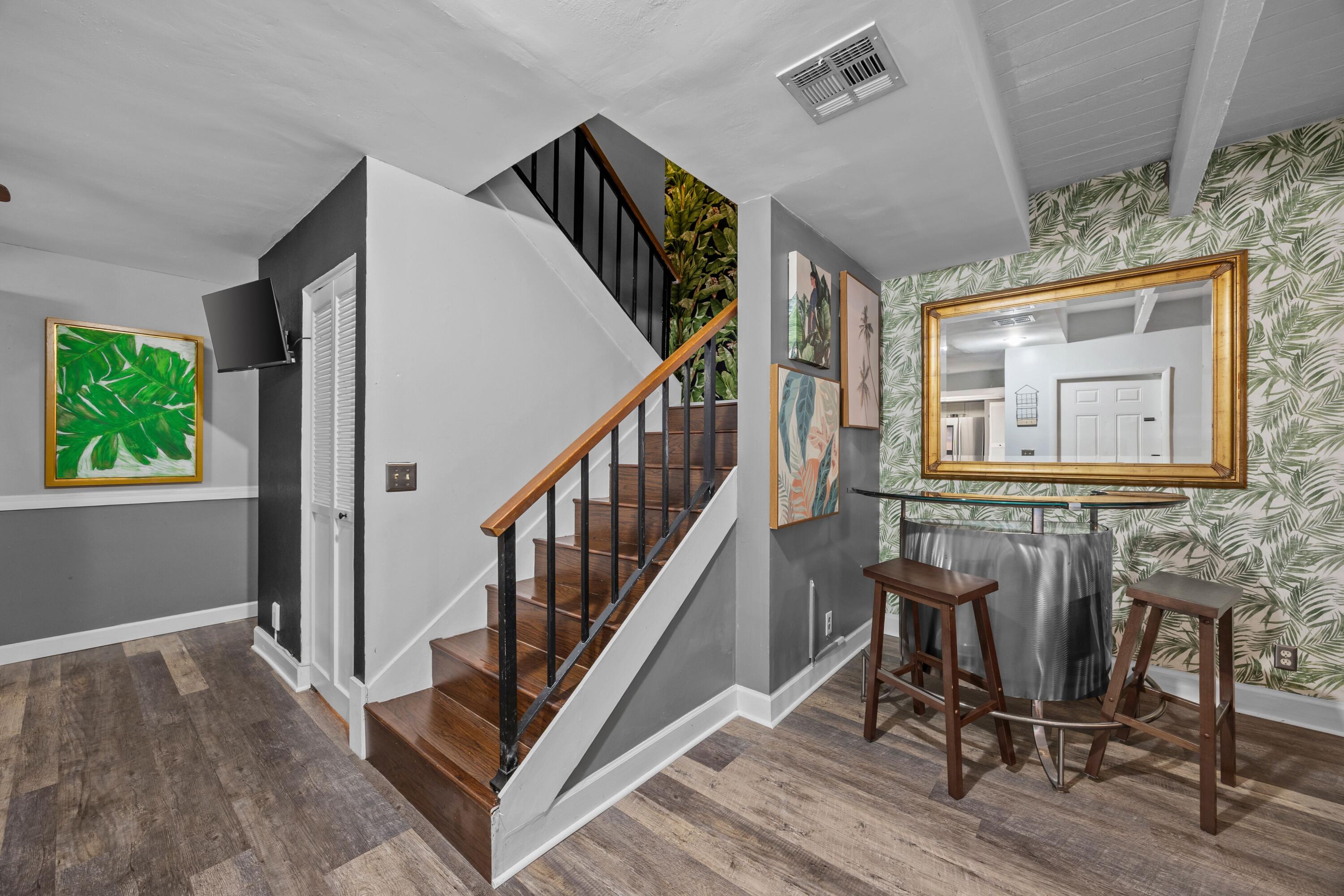 1520 Shaker Circle Wellington, FL 33414 - Photo 5 of 19 a view of a hallway with wooden floor and windows