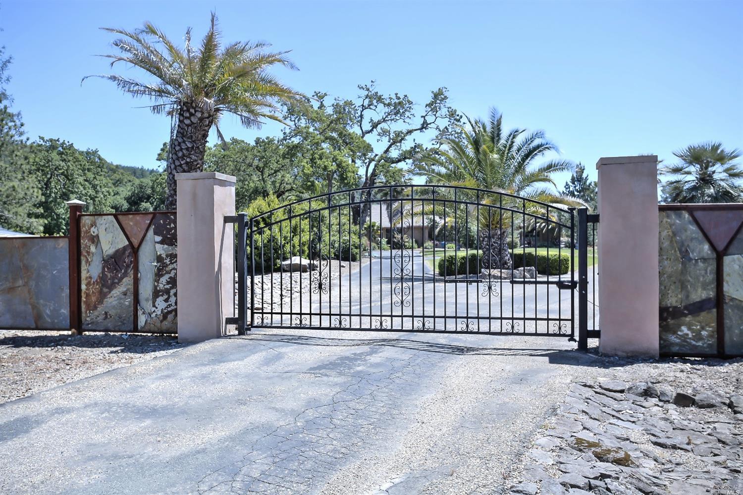 247 Somerville Road Santa Rosa, CA 95409 - Photo 1 of 1 a view of a house with a iron fence