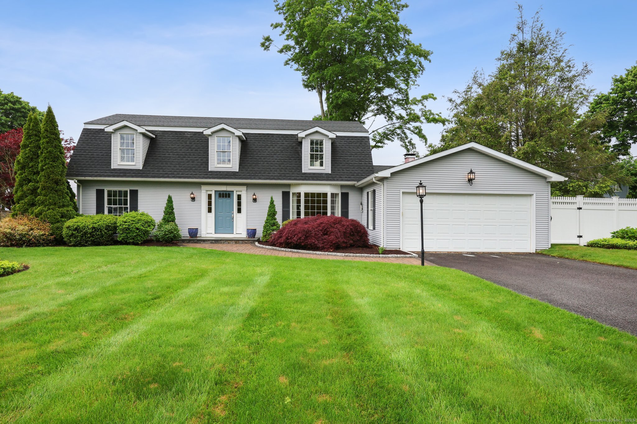 Welcome to 20 Cherry Lane! Enjoy life on a private road with expansive views of the Madison Country Club golf course.