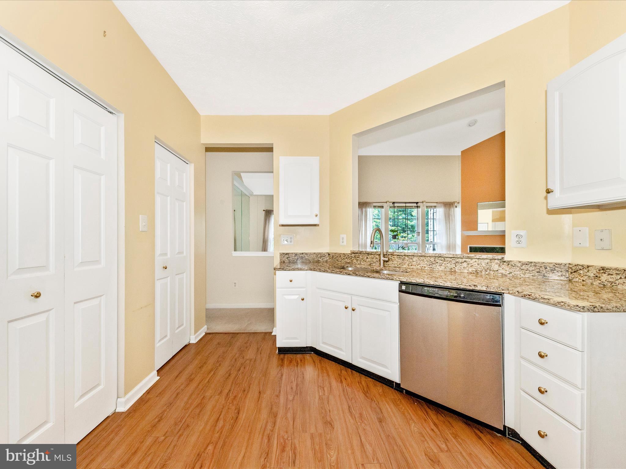 6125 Springwater Place, Unit K Frederick, MD 21701 - Photo 12 of 63 a spacious bathroom with a granite countertop sink and a large mirror