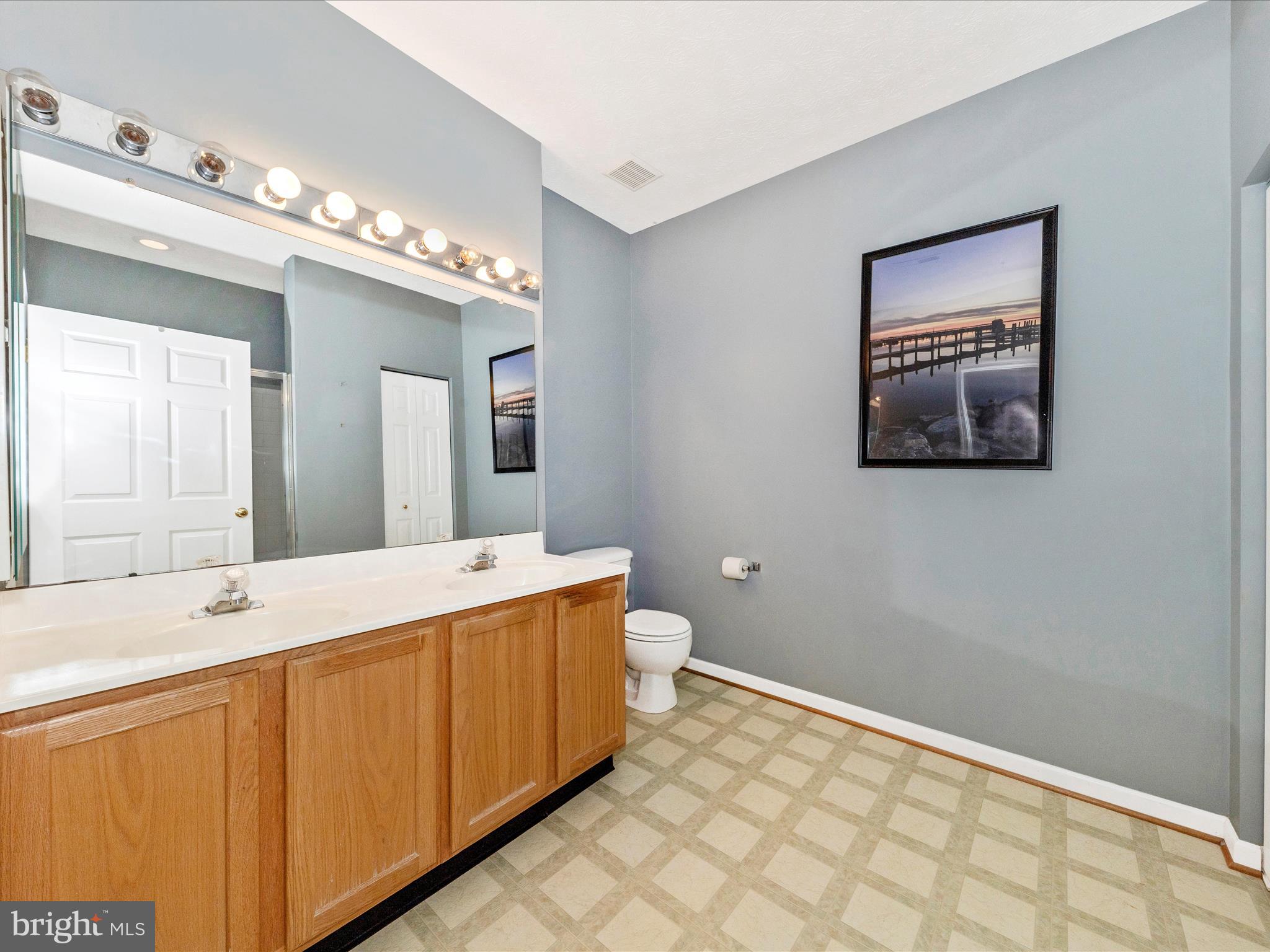 6125 Springwater Place, Unit K Frederick, MD 21701 - Photo 23 of 63 a spacious bathroom with a double vanity sink and a mirror