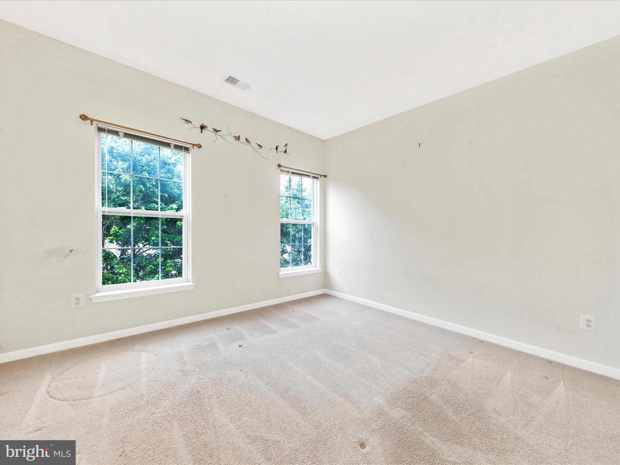 6125 Springwater Place, Unit K Frederick, MD 21701 - Photo 24 of 63 an empty room with windows