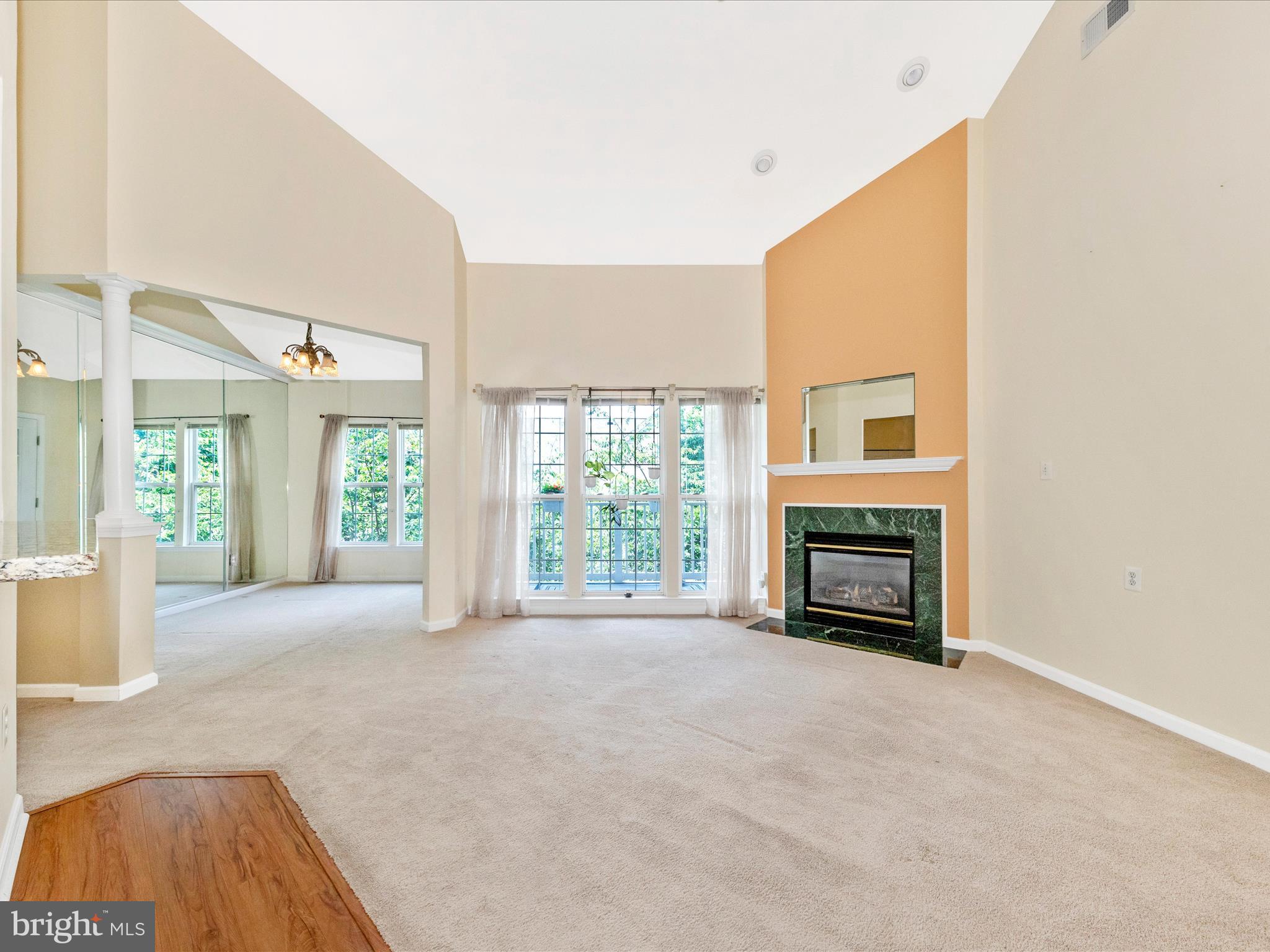 6125 Springwater Place, Unit K Frederick, MD 21701 - Photo 4 of 63 a view of an empty room with a fireplace and a window