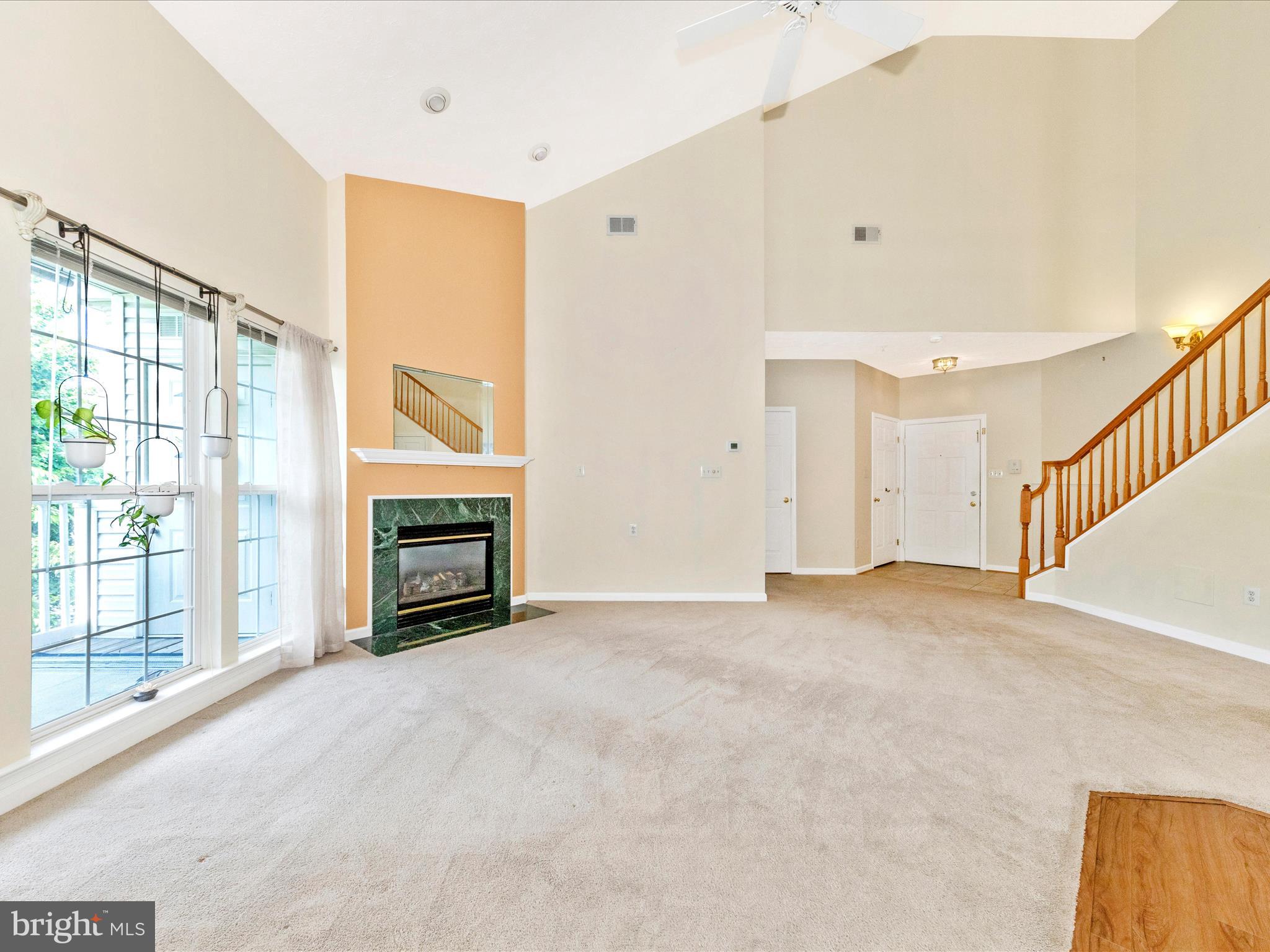 6125 Springwater Place, Unit K Frederick, MD 21701 - Photo 6 of 63 a view of an empty room with a fireplace and a window