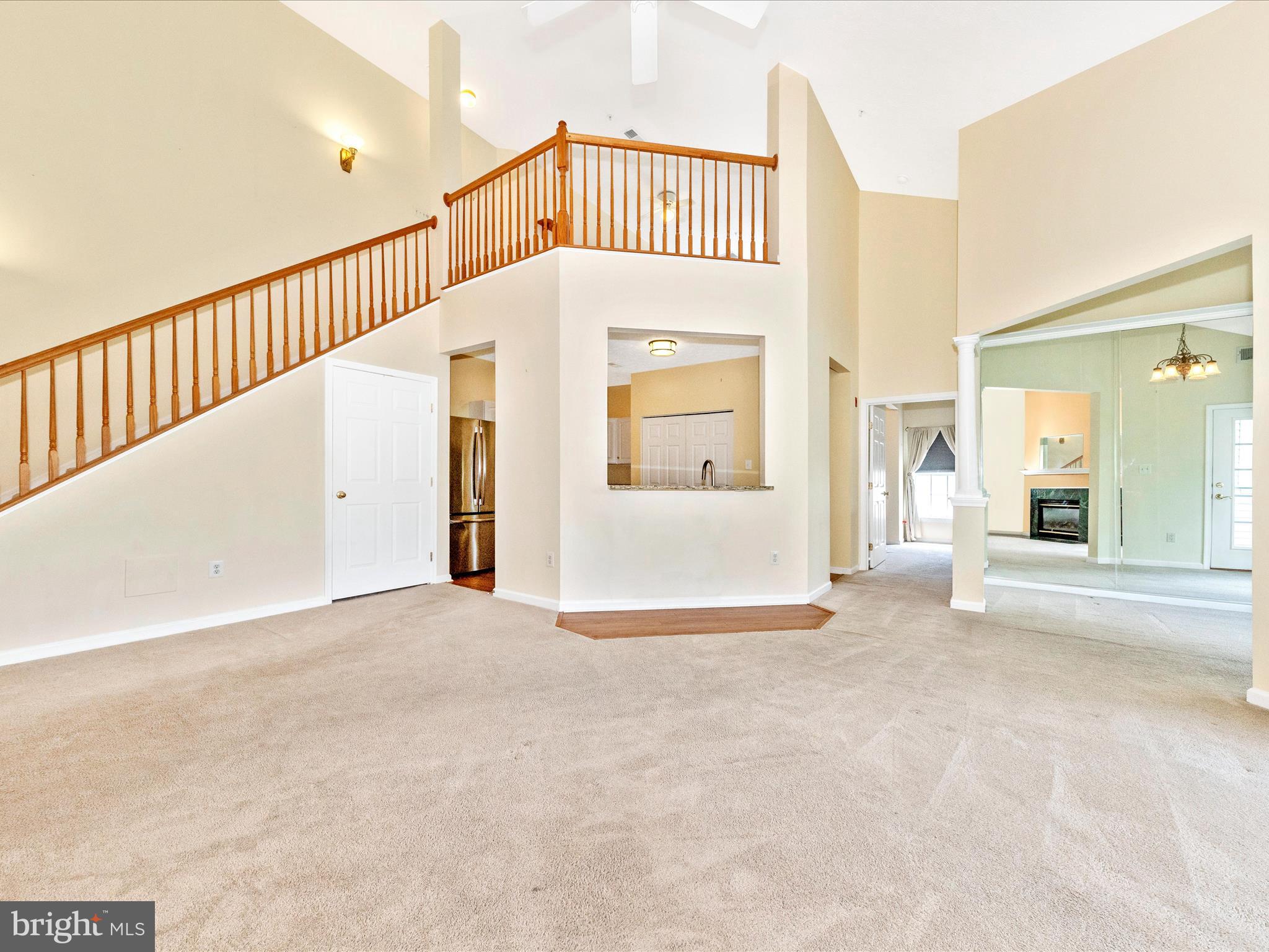6125 Springwater Place, Unit K Frederick, MD 21701 - Photo 7 of 63 a view of a livingroom with wooden floor and a large window