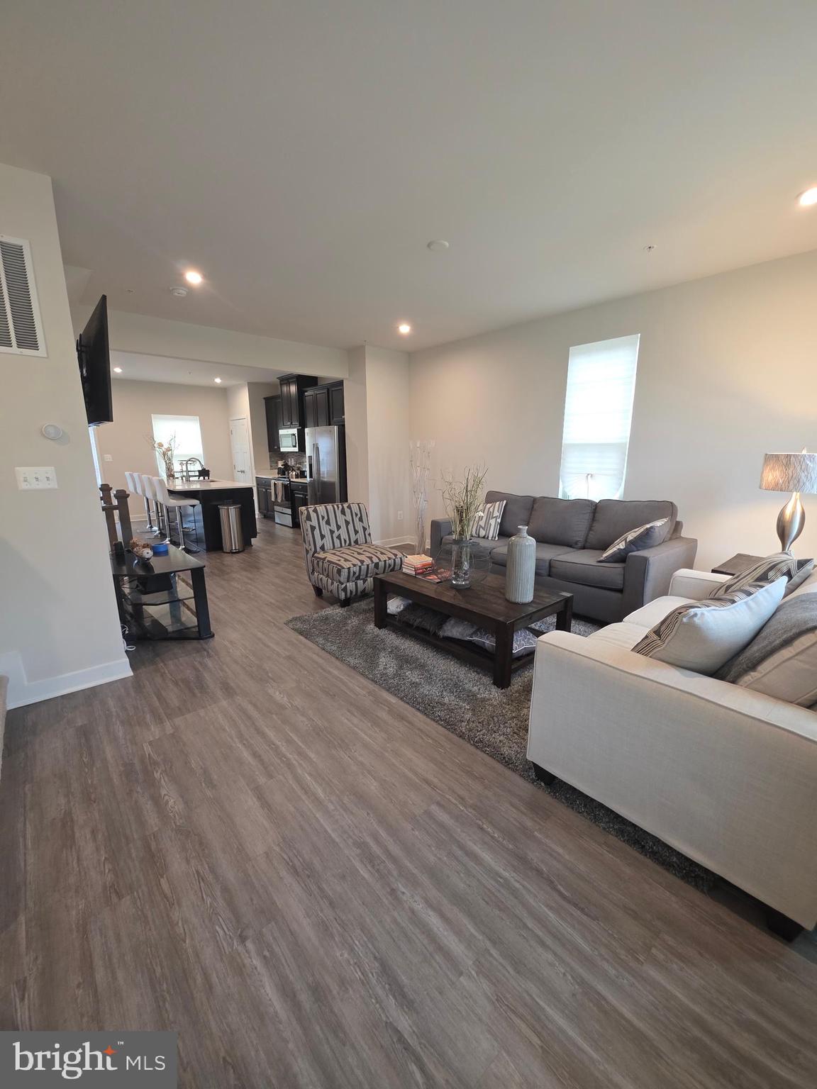 14510 Hunts Farm Road Brandywine, MD 20613 - Photo 18 of 74 a living room with furniture and a wooden floor