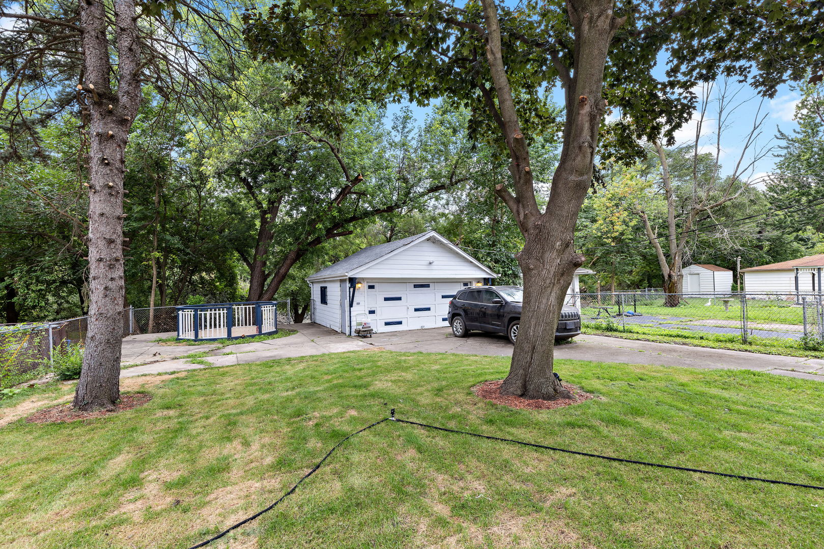 320 Streamside Drive Harvey, IL 60426 - Photo 20 of 26 a house with trees in front of it