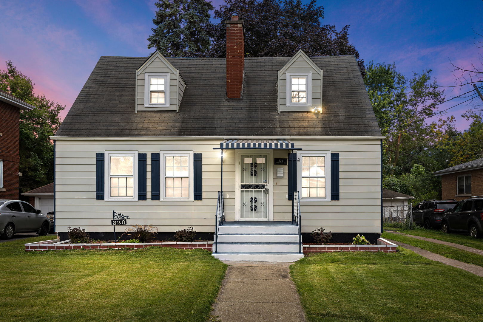 320 Streamside Drive Harvey, IL 60426 - Photo 2 of 26 a front view of a house with a yard