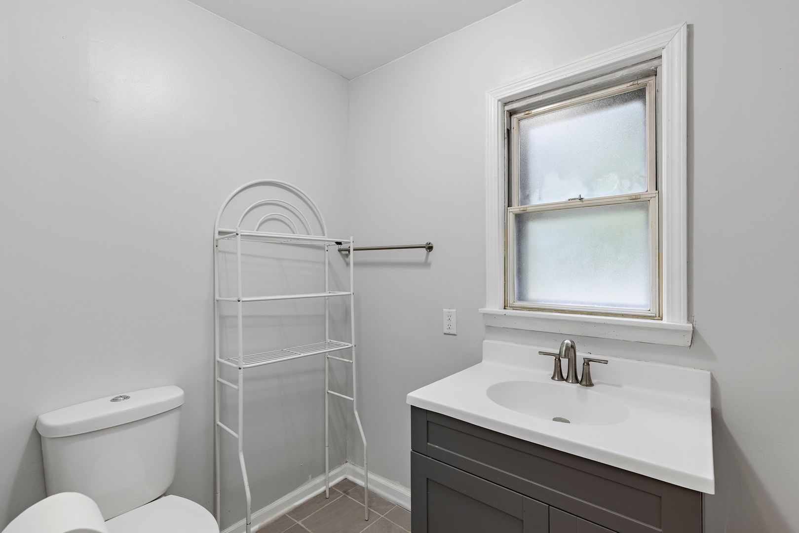 320 Streamside Drive Harvey, IL 60426 - Photo 10 of 26 a bathroom with a sink a toilet and a mirror