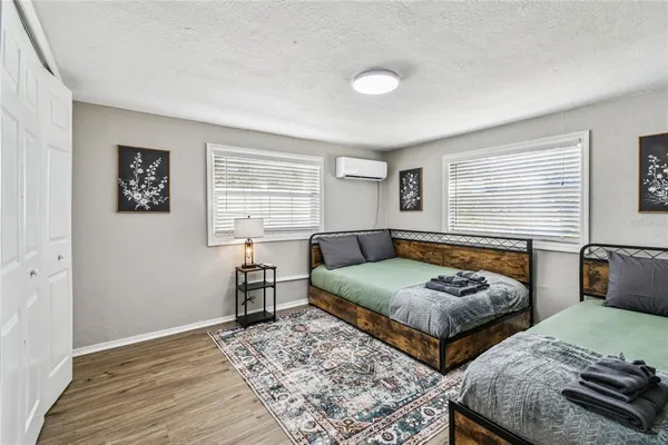 a view of a dining room with furniture and a kitchen