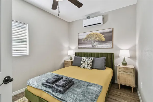 a bedroom with bed and a window