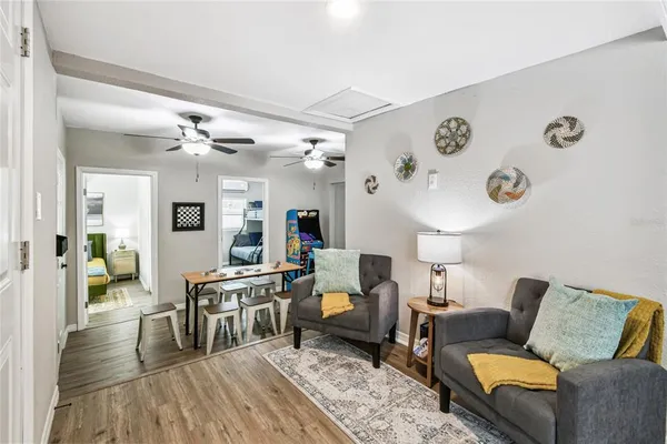 a living room with furniture and a potted plant