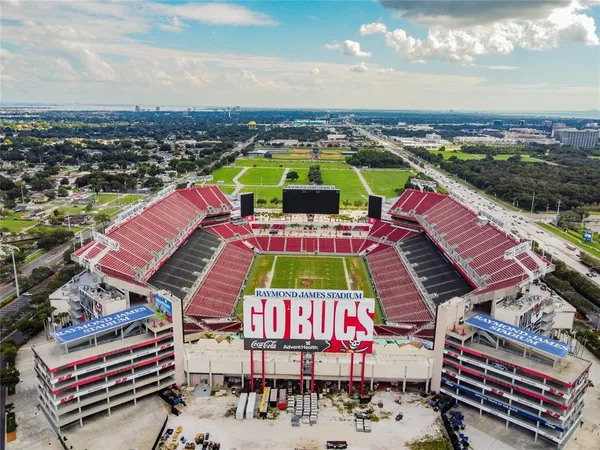 a large building with swimming pool in front of it