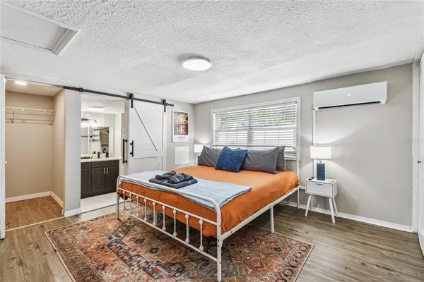 a bed room with a bed and a table