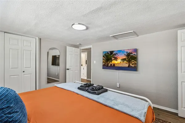 a bathroom with a granite countertop sink mirror toilet and shower
