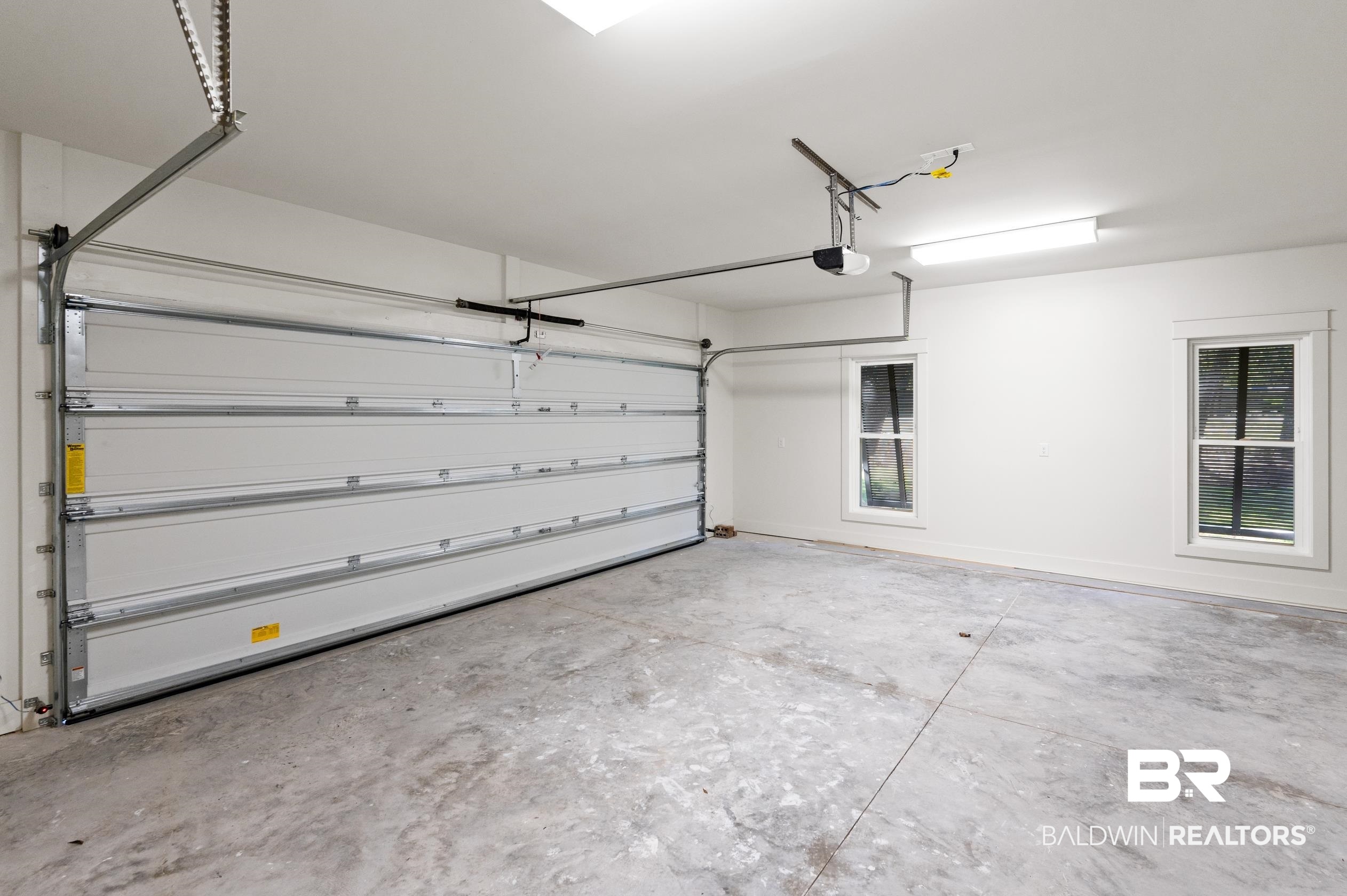 28889 Canal Road Orange Beach, AL 36561 - Photo 20 of 55 Garage with a garage door opener