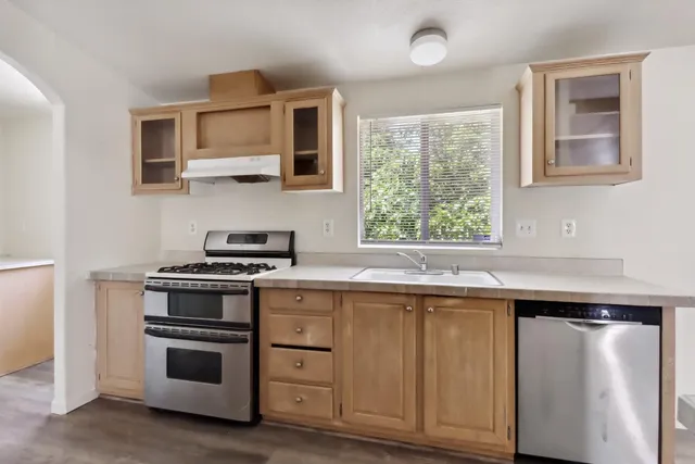 a kitchen with a stove and a sink