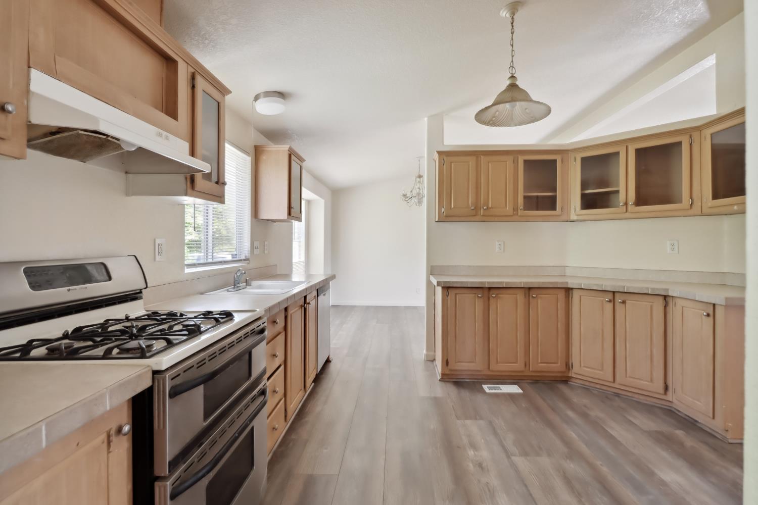 22115 Pleasant Valley Road North San Juan, CA 95960 - Photo 13 of 85 a kitchen with stainless steel appliances granite countertop a stove and a wooden cabinets