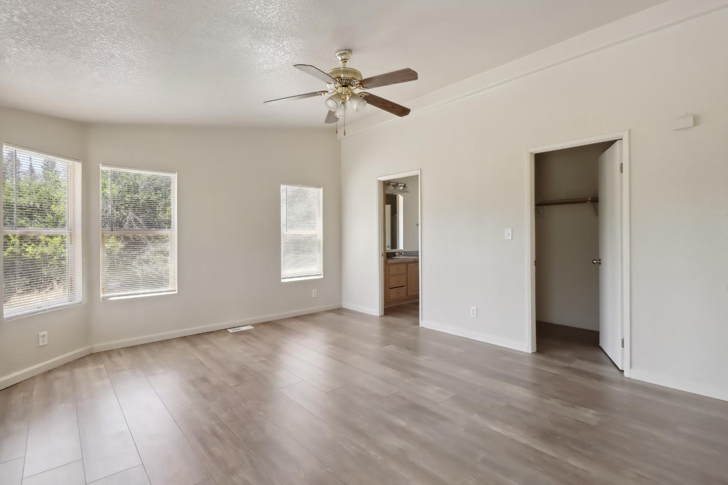 22115 Pleasant Valley Road North San Juan, CA 95960 - Photo 23 of 85 a view of an empty room with wooden floor and a window