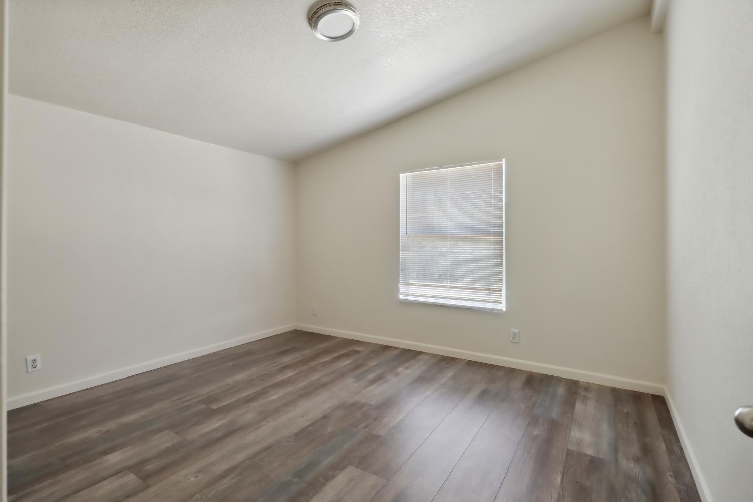 22115 Pleasant Valley Road North San Juan, CA 95960 - Photo 30 of 85 an empty room with wooden floor and windows