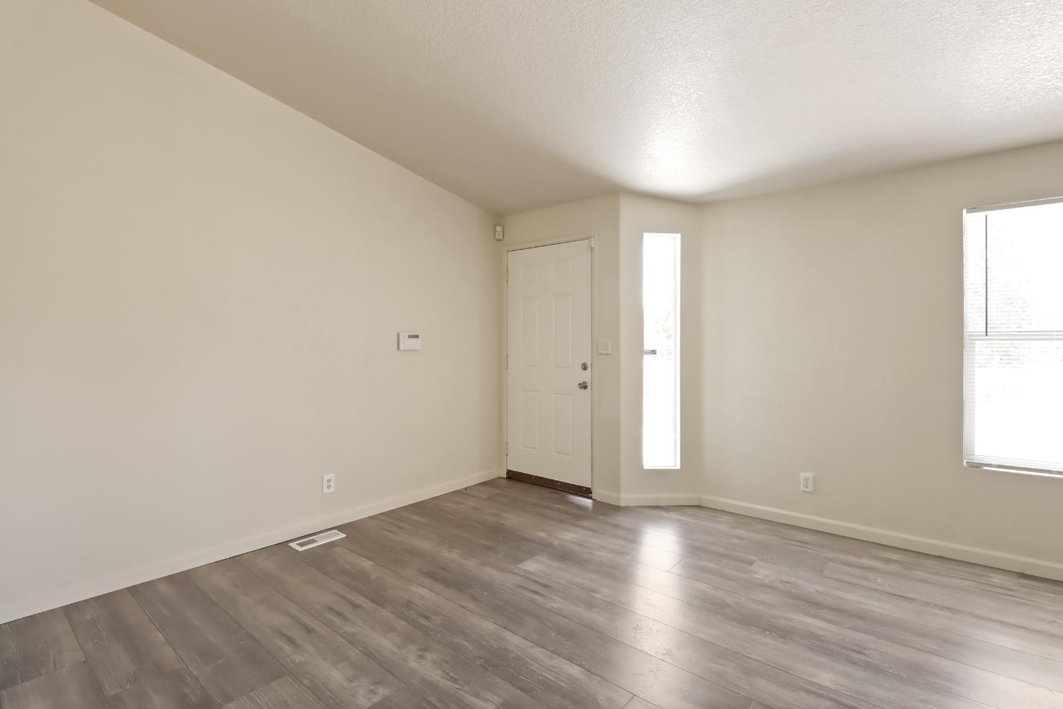 22115 Pleasant Valley Road North San Juan, CA 95960 - Photo 3 of 85 an empty room with wooden floor and windows