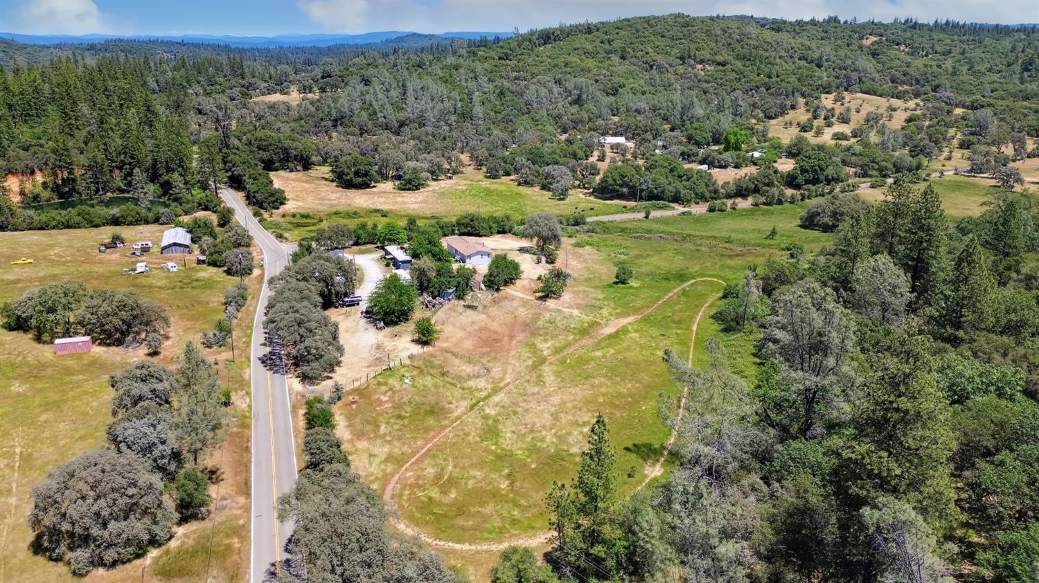 22115 Pleasant Valley Road North San Juan, CA 95960 - Photo 66 of 85 a view of a lake with a mountain in the background