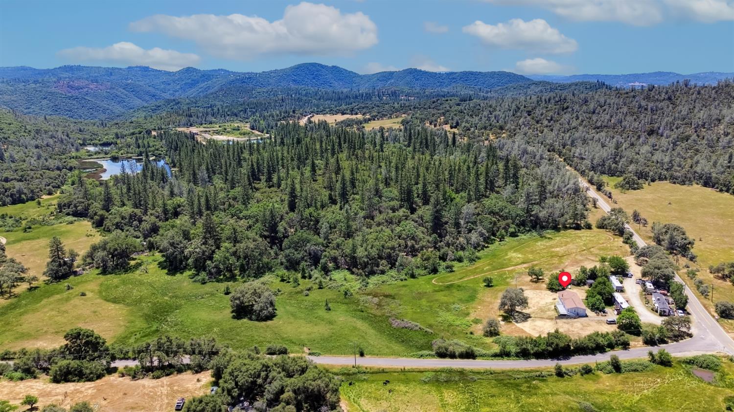 22115 Pleasant Valley Road North San Juan, CA 95960 - Photo 71 of 85 a view of a lush green hillside and houses