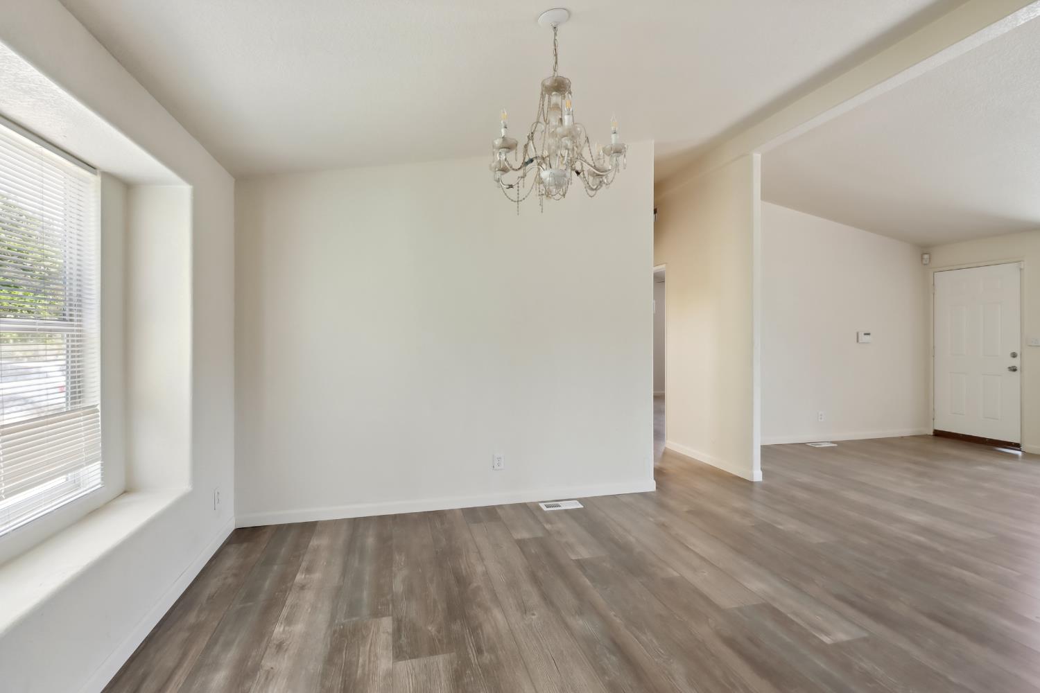 22115 Pleasant Valley Road North San Juan, CA 95960 - Photo 9 of 85 a view of an empty room with wooden floor and a window
