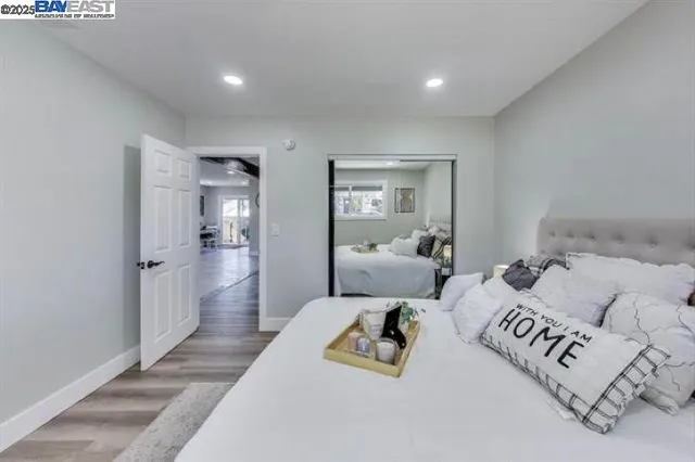 a view of a backyard with wooden fence