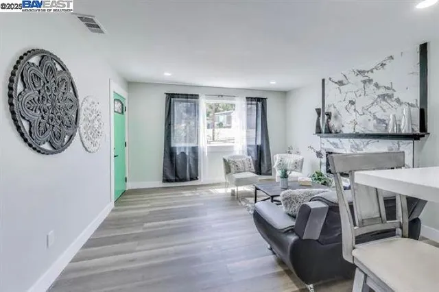 a view of a livingroom with furniture and a workspace