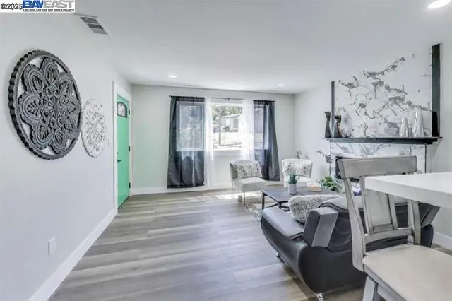 a view of a livingroom with furniture and a workspace