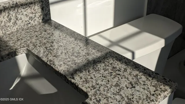 a view of a brick house with a tree