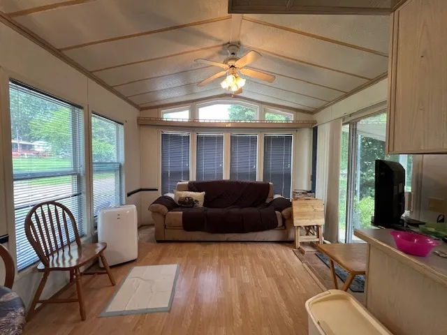 a view of a dining room with furniture window and wooden floor
