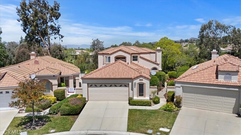39973 Corte Lorca Murrieta, CA 92562 - Photo 2 of 72 a front view of a house with a garden