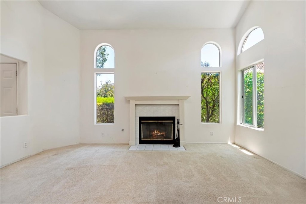 39973 Corte Lorca Murrieta, CA 92562 - Photo 21 of 72 an empty room with windows and fireplace