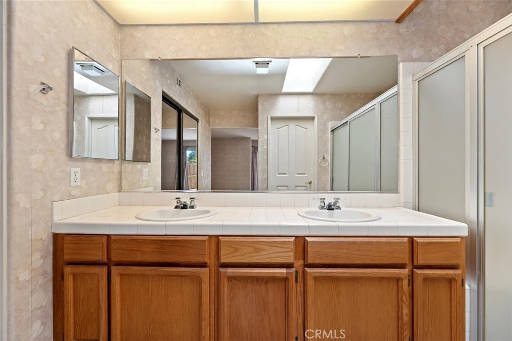 39973 Corte Lorca Murrieta, CA 92562 - Photo 25 of 72 a bathroom with a sink and a mirror