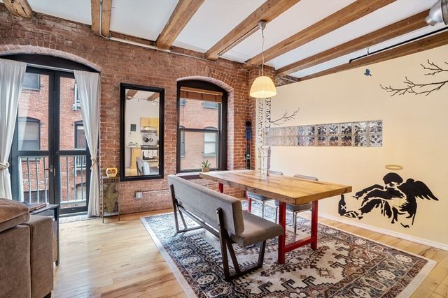 a dining room with a table and chairs