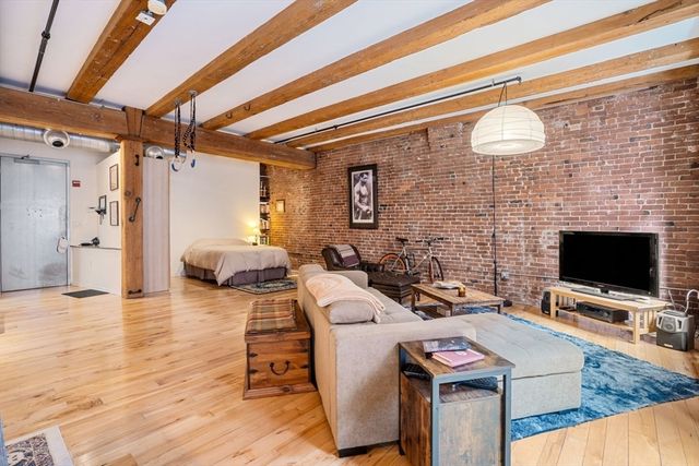 a room with furniture and a flat screen tv