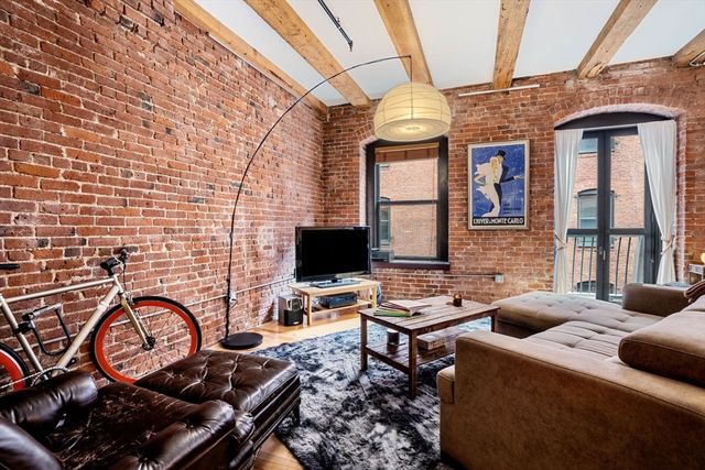 a view of a workspace with furniture