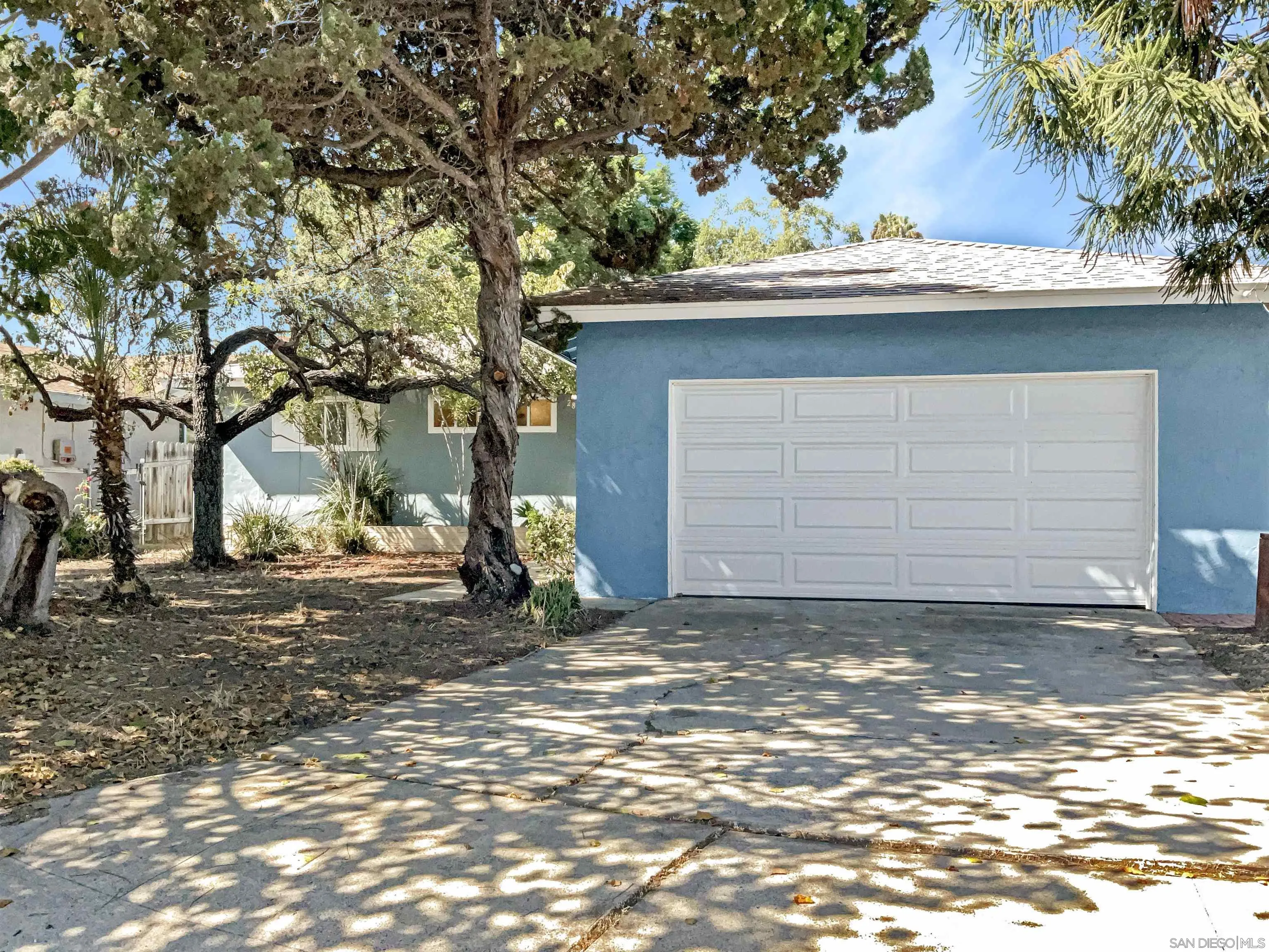 a small white house with a outdoor space