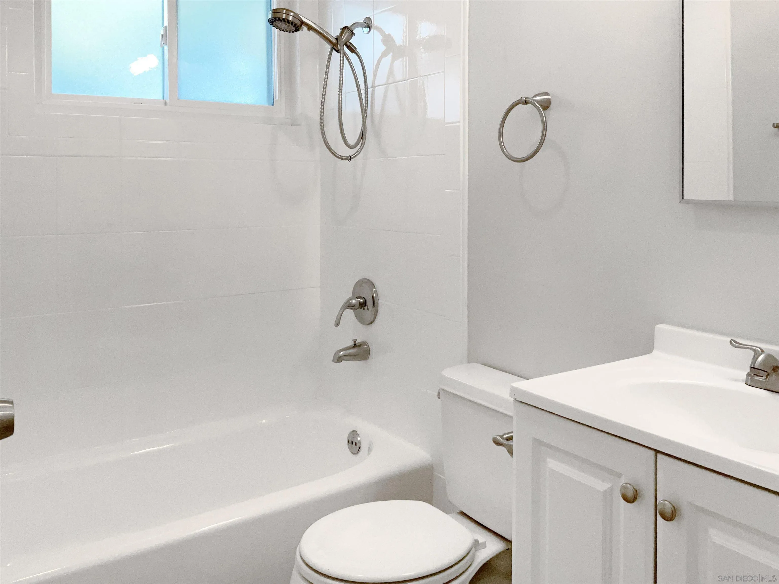 2850 Skyline Drive Lemon Grove, CA 91945 - Photo 13 of 17 a bathroom with a sink a toilet and shower