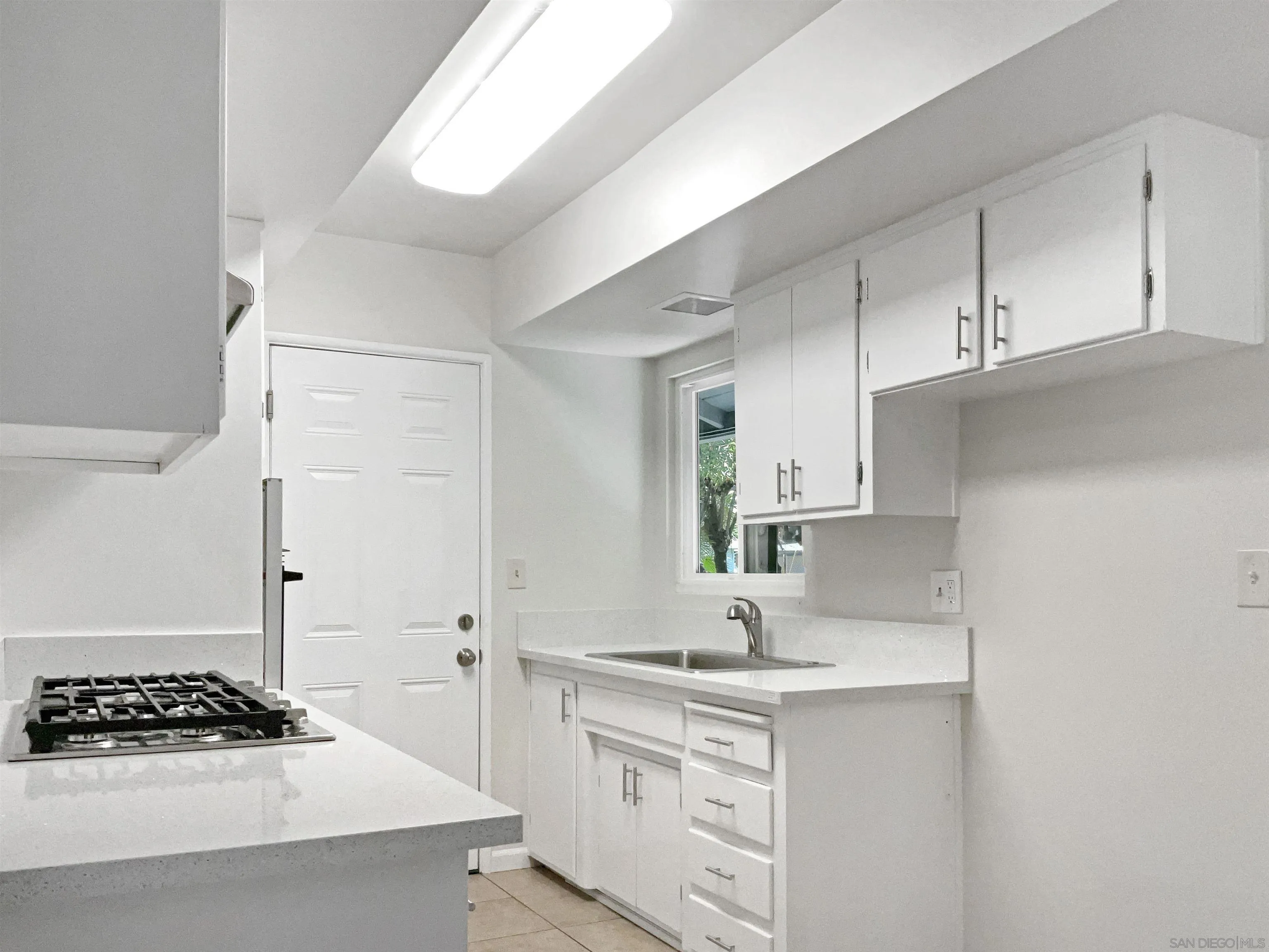 2850 Skyline Drive Lemon Grove, CA 91945 - Photo 8 of 17 a kitchen with stainless steel appliances a sink stove and cabinets