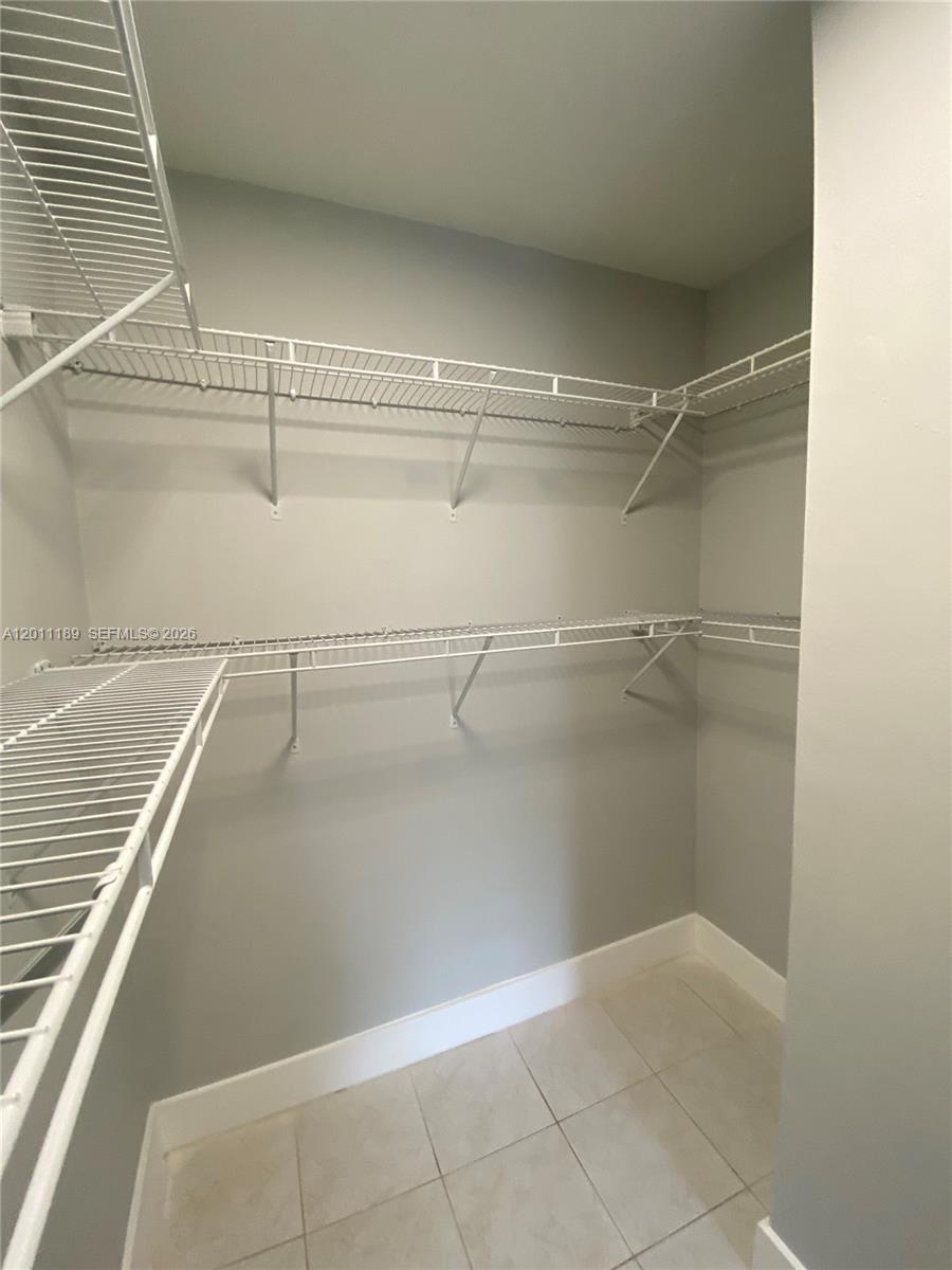 455 South Pine Island Road, Unit 110C Plantation, FL 33324 - Photo 12 of 30 a view of a room with racks on the wall
