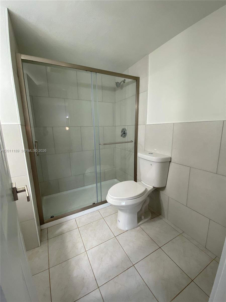 455 South Pine Island Road, Unit 110C Plantation, FL 33324 - Photo 14 of 30 a bathroom with a toilet and a shower